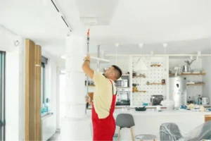 Handyman fixing a broken window