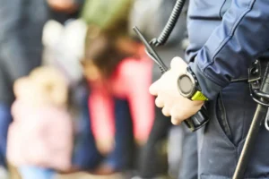 Security officer monitoring access at a corporate office building